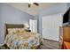 Bright bedroom featuring a closet, wood-look floors, and floral bedding at 1152 Pine Cove Ct, Henderson, NV 89011