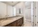 This bathroom features dual sinks with granite countertop, and a glass enclosed shower stall at 11540 Snow Creek Ave, Las Vegas, NV 89135