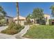 Charming single-story home features a well-manicured lawn, desert landscaping, and inviting entrance at 11540 Snow Creek Ave, Las Vegas, NV 89135