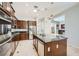 Modern kitchen features updated stainless appliances, granite countertops, and center island at 11540 Snow Creek Ave, Las Vegas, NV 89135