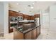 Gourmet kitchen boasts stainless steel appliances and a large center island with bar seating at 11540 Snow Creek Ave, Las Vegas, NV 89135