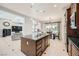 Open kitchen with center island flows into the dining and living areas at 11540 Snow Creek Ave, Las Vegas, NV 89135