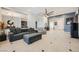 Spacious living room with an open layout, modern furnishings, and a neutral color palette at 11540 Snow Creek Ave, Las Vegas, NV 89135