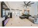 Modern living room featuring a decorative fireplace, large TV, and access to outdoor patio at 11540 Snow Creek Ave, Las Vegas, NV 89135