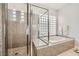 Contemporary main bathroom showcasing a walk-in shower and separate soaking tub at 11540 Snow Creek Ave, Las Vegas, NV 89135