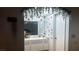 Decorated bathroom with red heart and butterfly accents on the walls and white floral ornamentation at 1653 Crystal Shadows Cir, Las Vegas, NV 89119