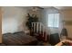 Bright bedroom features a comfortable bed, large windows, and functional workspace at 1653 Crystal Shadows Cir, Las Vegas, NV 89119