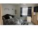 Cozy bedroom featuring a patterned bedspread and a decorative accent wall at 1653 Crystal Shadows Cir, Las Vegas, NV 89119