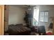 Bright bedroom features a comfortable bed, large windows, and functional workspace at 1653 Crystal Shadows Cir, Las Vegas, NV 89119