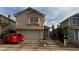 Charming two-story homes with well-maintained exteriors, driveways, and attached garages at 1653 Crystal Shadows Cir, Las Vegas, NV 89119