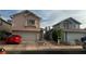 Charming two-story homes with well-maintained exteriors, driveways, and attached garages at 1653 Crystal Shadows Cir, Las Vegas, NV 89119