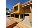 Exterior view of new construction highlighting foundation work and wood framing of a modern home at 1764 Amarone Way, Henderson, NV 89012