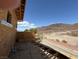 Exterior of home under construction with partial roof, desert landscape and mountain views at 1764 Amarone Way, Henderson, NV 89012