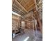 Interior view of new construction showing wood framing and a metal scaffold at 1764 Amarone Way, Henderson, NV 89012