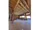 Interior view of a home under construction, showcasing exposed wooden beams and framing at 1764 Amarone Way, Henderson, NV 89012