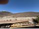 Exterior view of a home under construction with desert mountain views in the background at 1764 Amarone Way, Henderson, NV 89012
