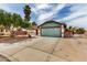 Charming single-story home features a large driveway, two car garage and desert landscaping at 1816 Mazzanti Way, Henderson, NV 89014
