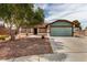 Charming single-story home featuring desert landscaping, a two-car garage, and a welcoming entrance at 1816 Mazzanti Way, Henderson, NV 89014