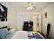 Functional bedroom with ceiling fan, ample desk space, and neutral paint at 1912 E Pyle Ave, Las Vegas, NV 89183