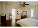 Relaxing main bedroom featuring wood-look floors, ensuite bathroom, and a ceiling fan at 1912 E Pyle Ave, Las Vegas, NV 89183