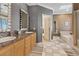 Bathroom with double sinks, granite countertops and tiled floors at 2355 Villandry Ct, Henderson, NV 89074