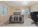 Cozy bedroom with two large windows and a ceiling fan for added comfort at 2355 Villandry Ct, Henderson, NV 89074