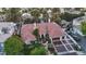 An aerial shot showing the home's tile roof, three-car garage, and meticulously landscaped surroundings at 2355 Villandry Ct, Henderson, NV 89074