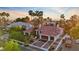 A picturesque single-story home featuring a tile roof, tall palm trees, and well-maintained landscaping at 2355 Villandry Ct, Henderson, NV 89074