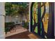 Unique front door with custom glasswork, patio, and outdoor seating area at 2355 Villandry Ct, Henderson, NV 89074