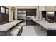 Kitchen with stone counters, a stainless steel refrigerator and a eat-in area at 2355 Villandry Ct, Henderson, NV 89074
