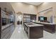 Gourmet kitchen features a stone island, high-end appliances, and lots of storage at 2355 Villandry Ct, Henderson, NV 89074