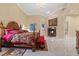 Grand main bedroom boasts a fireplace, accent wall, and luxurious finishes at 2355 Villandry Ct, Henderson, NV 89074