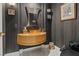 Chic powder room with vessel sink, unique mirror, and stylish wallpaper at 2355 Villandry Ct, Henderson, NV 89074