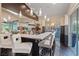 Luxurious wet bar with marble countertops, pendant lighting, and ample seating at 2355 Villandry Ct, Henderson, NV 89074