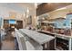 Entertainers dream wet bar with marble countertops, and beverage refrigerator at 2355 Villandry Ct, Henderson, NV 89074