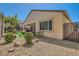 Side view of a home with hot tub, patio area, and landscaping at 2534 Starlight Valley St, Henderson, NV 89044