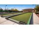 Wide view of immaculately maintained bocce ball courts under a clear blue sky at 2534 Starlight Valley St, Henderson, NV 89044