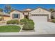 Charming single-story home featuring a well-manicured lawn and a two-car garage at 2534 Starlight Valley St, Henderson, NV 89044