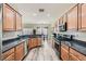 Well-lit kitchen showcasing stainless steel appliances, granite counters, and ample cabinet space at 2534 Starlight Valley St, Henderson, NV 89044