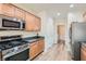 Bright kitchen featuring modern appliances, granite countertops, and neutral cabinetry at 2534 Starlight Valley St, Henderson, NV 89044