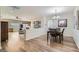 Open living space with hardwood floors connecting the living room and dining area at 2534 Starlight Valley St, Henderson, NV 89044