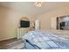 Relaxing main bedroom featuring a dresser with a mirror and a view to the Primary bath at 2534 Starlight Valley St, Henderson, NV 89044