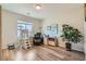Bright office space featuring wood floors, a large window, and a full work station at 2534 Starlight Valley St, Henderson, NV 89044
