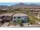 Aerial view of a two-story home with a tile roof, surrounded by a landscaped yard in a residential community at 257 Elder View Dr, Las Vegas, NV 89138