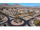 Expansive aerial view of a residential neighborhood featuring well-maintained streets and lush landscaping at 257 Elder View Dr, Las Vegas, NV 89138