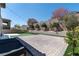 Lovely backyard featuring a putting green, patio and brick wall at 257 Elder View Dr, Las Vegas, NV 89138