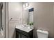 Powder room featuring a pedestal sink, decorative mirror and fixtures at 257 Elder View Dr, Las Vegas, NV 89138