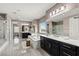 Spacious bathroom with a soaking tub, separate vanities, and a glass-enclosed shower at 257 Elder View Dr, Las Vegas, NV 89138