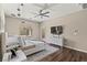 Bright bedroom with dark wood flooring, neutral walls, and sliding glass door access at 257 Elder View Dr, Las Vegas, NV 89138