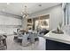 Dining area with stylish lighting and easy access to an outdoor patio through sliding glass doors at 257 Elder View Dr, Las Vegas, NV 89138